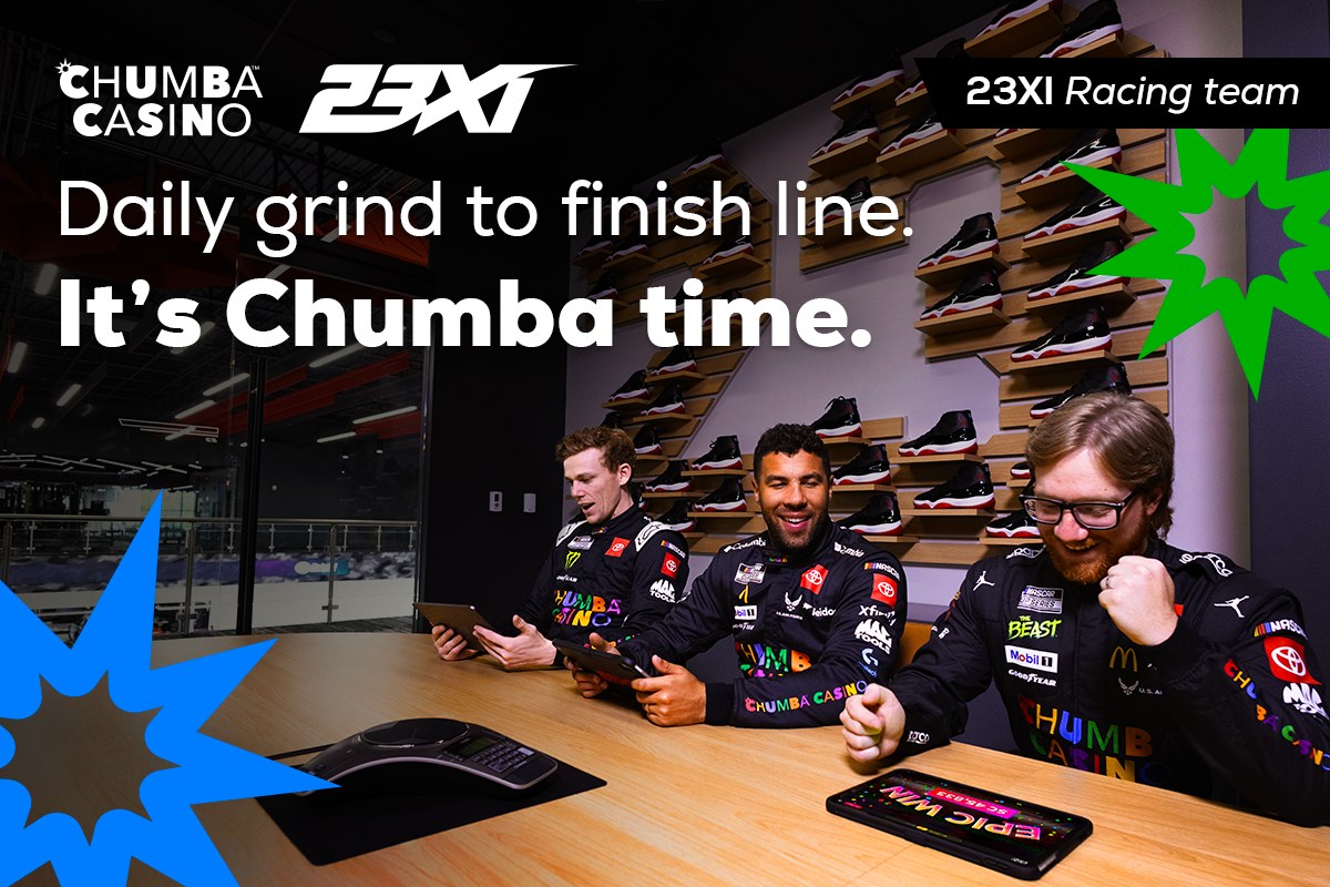 Chumba Casino and 23XI email header: three 23XI drivers playing on tablets in the team lounge. Daily grind to finish line. It’s Chumba time.