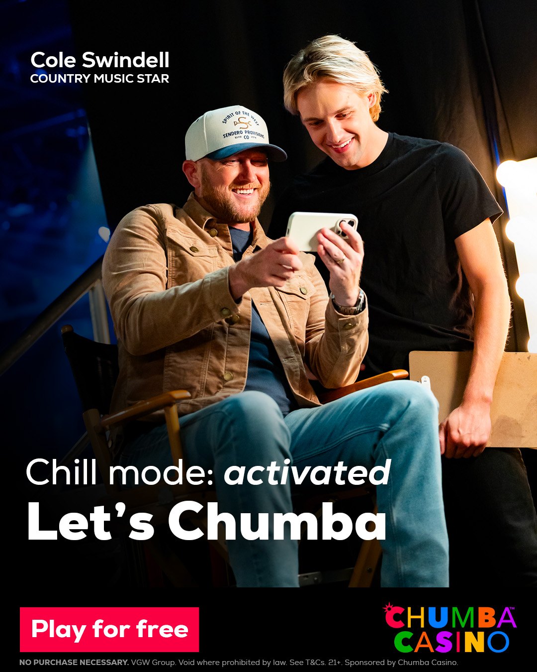 Chumba Casino Instagram post: Cole Swindell and a crew member smiling at a phone backstage. Chill mode: activated. Let’s Chumba.