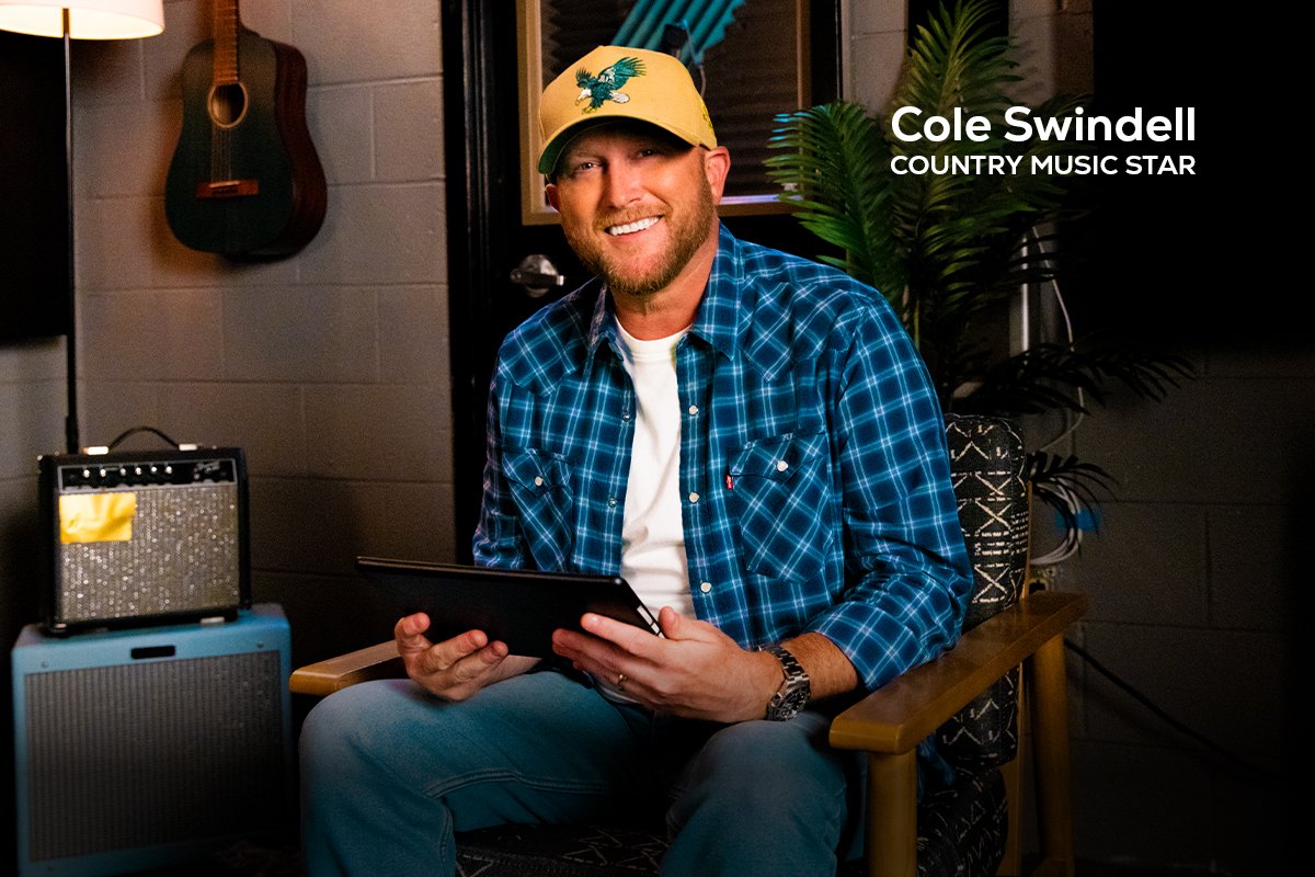 Chumba Casino email header: Cole Swindell seated in the recording studio holding a tablet.